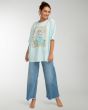 Mujer con camiseta holgada de manga corta Billabong Daydream Away azul turquesa lateral