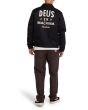 Hombre con Cazadora Deus Ex Machina Workwear Jacket 2.0 Negra posterior