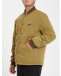 Hombre con chaqueta acolchada reversible Volcom Lookster anverso mostaza bolsillos 