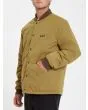 Hombre con chaqueta acolchada reversible Volcom Lookster anverso mostaza bolsillos 