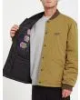 Hombre con chaqueta acolchada reversible Volcom Lookster anverso mostaza interior