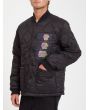 Hombre con chaqueta acolchada reversible Volcom Lookster anverso negra bolsillo