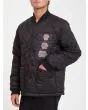Hombre con chaqueta acolchada reversible Volcom Lookster anverso negra bolsillo