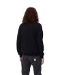Hombre con con jersey de lana Carhartt WIP Madison Sweater Dark Navy/Wax espalda