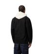 Hombre con chaqueta Carhartt WIP Michigan Coat negra posterior