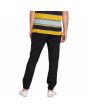 Hombre con pantalón de cintura elástica Volcom Frickin Slim Tapered Jogger negro posterior
