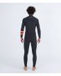 Hombre con traje de surf con cremallera en el pecho Hurley Plus 3/2mm negro grafito posterior