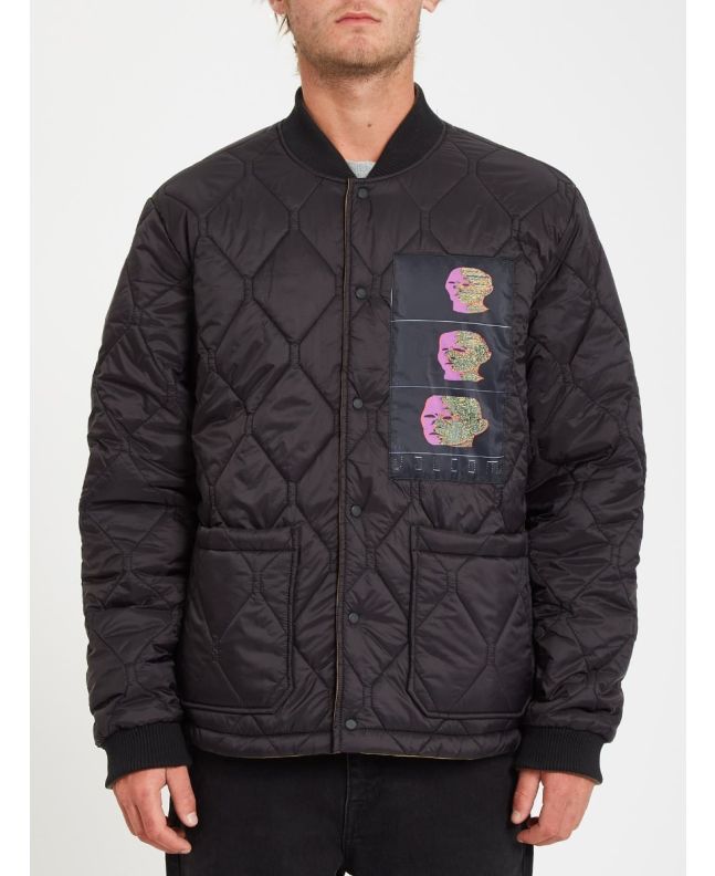 Hombre con chaqueta acolchada reversible Volcom Lookster anverso negra
