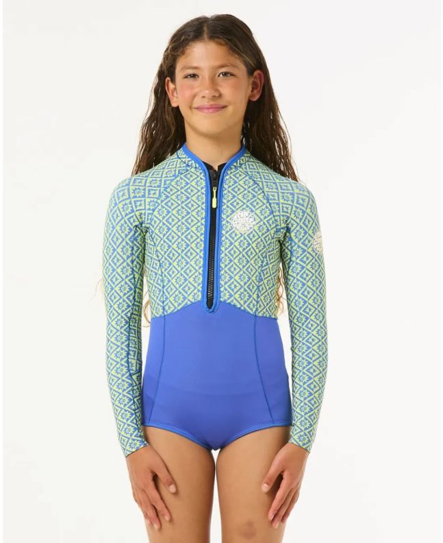 Niña con traje de neopreno corto Rip Curl Junior G Bomb 1.5mm Spring con cremallera frontal Azul 