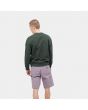 Hombre con sudadera Carhartt WIP Pocket Sweat verde posterior