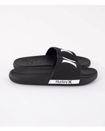 Chanclas Hurley Magu Slide negras y blancas para hombre con logotipo Hurley blanco sobre pala negra