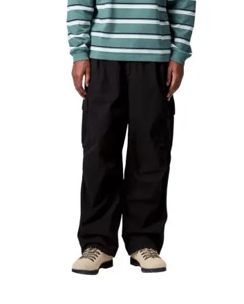 Hombre con pantalones Carhartt WIP Cole Cargo Negros